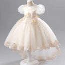 Ivory flower girl dress on a mannequin against a gray background, Obroi