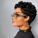 Mannequin head with styled black hair wearing gold glasses and earrings against a gray background, Obroi