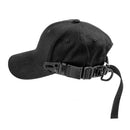 A black baseball cap with an adjustable rear strap and buckle closure, shown on a white background with four separate buckle components displayed below, Obroi