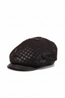 Black patterned cap with leather brim on a white background, Obroi