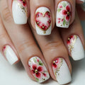 Nails with floral and heart designs on a white background, Obroi
