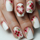 Nails with floral and heart designs on a white background, Obroi