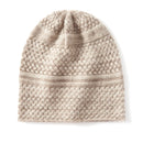 Knitted beanie with cable pattern on a white background, Obroi