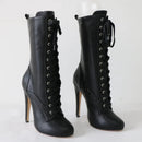 Black high-heeled lace-up boots on a white background, Obroi