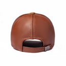 Brown leather baseball cap shown from the back, featuring a curved back strap with a silver metal snap button, Obroi