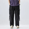 Person wearing black cargo pants and a purple shirt on a white background, Obroi