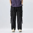Person wearing black cargo pants and a purple shirt on a white background, Obroi