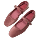 Pair of pink flats with a strap and buckle on a white background, Obroi