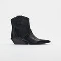 Black cowboy boot with intricate design on a light gray background, Obroi
