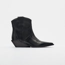 Black cowboy boot with intricate design on a light gray background, Obroi