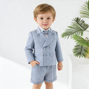Child wearing a blue checkered suit with a bow tie on a white background, Obroi