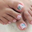 Close-up of toes with floral nail art on a light background, Obroi