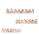 Set of rose gold nail art decorations on a white background