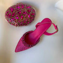 Pink embellished shoe and matching handbag on a white background, Obroi