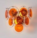 Modern ceiling light fixture with orange glass shades on a white background, Obroi