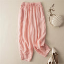 Pink pants with a white handbag and shoes on a beige background, Obroi