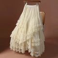White ruffled skirt on a chair against a brown background, Obroi