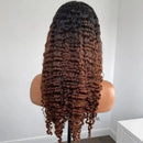A long, dark brown to auburn ombre wave wig displayed on a mannequin head stand against a plain white wall, Obroi