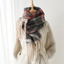 Plaid scarf with tassels draped over a white coat on a wooden stand against a white background, Obroi