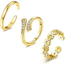 Set of gold rings with different designs on a white background, Obroi