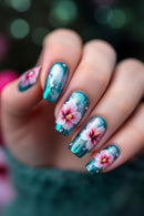 Nails with floral design in teal and pink on a blurred background, Obroi