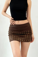 Brown polka dot skirt worn by a person on a white background, Obroi