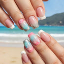 Nails with beach-themed design in front of a beach background, Obroi