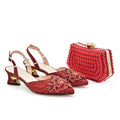 Red embellished shoes and matching handbag on a white background, Obroi