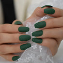Close-up of hands with dark green nail polish holding a white lace fabric ,Obroi