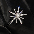 Decorative hair clip with pearl and crystal design on a black background, Obroi