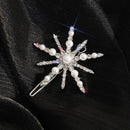 Decorative hair clip with pearl and crystal design on a black background, Obroi