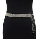 Silver belt with chain detail on a black dress against a white background, Obroi
