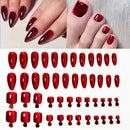 A set of glossy red press-on nails shown both applied to fingernails and toes, with rows of the individual nail shapes and sizes below on a white background, Obroi