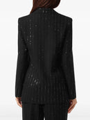 Black blazer with white speckled pattern worn by a person on a white background, Obroi