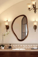 Bathroom with oval mirror, sink, and decorative elements, Obroi