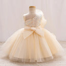 Beige flower girl dress on a mannequin against a plain background, Obroi