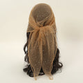 Brown headscarf with a bow on a mannequin head against a white background, Obroi