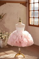 Pink floral dress on a mannequin against a neutral wall with a window, Obroi