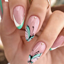 Nails with pink and green butterfly design on a blurred background, Obroi