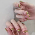 Close-up of hands with green nail polish on a neutral background, Obroi