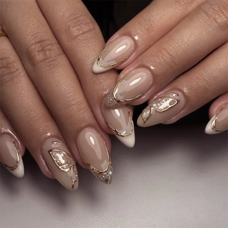 Obroi Close-up of hands with decorative nail art on a neutral background