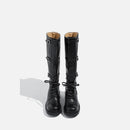 Pair of black knee-high boots on a white background, Obroi