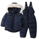 Navy blue winter jacket and bib overalls with white fur hood on a white background, Obroi