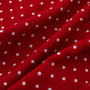 Red fabric with a white polka dot pattern, shown in soft folds, Obroi