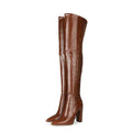 Pair of brown knee-high boots on a white background, Obroi