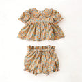 Floral baby top and bloomers set on a white background, Obroi