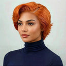 Woman with orange hair wearing a navy turtleneck against a light background, Obroi