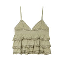 A light sage green ruffled camisole top with thin straps and delicate lace trim, displayed flat against a solid white background, Obroi
