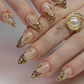 Nails with gold and beige design on a neutral background, Obroi