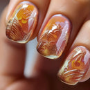 Nails with autumn-themed nail art featuring orange, brown, and pink colors, Obroi